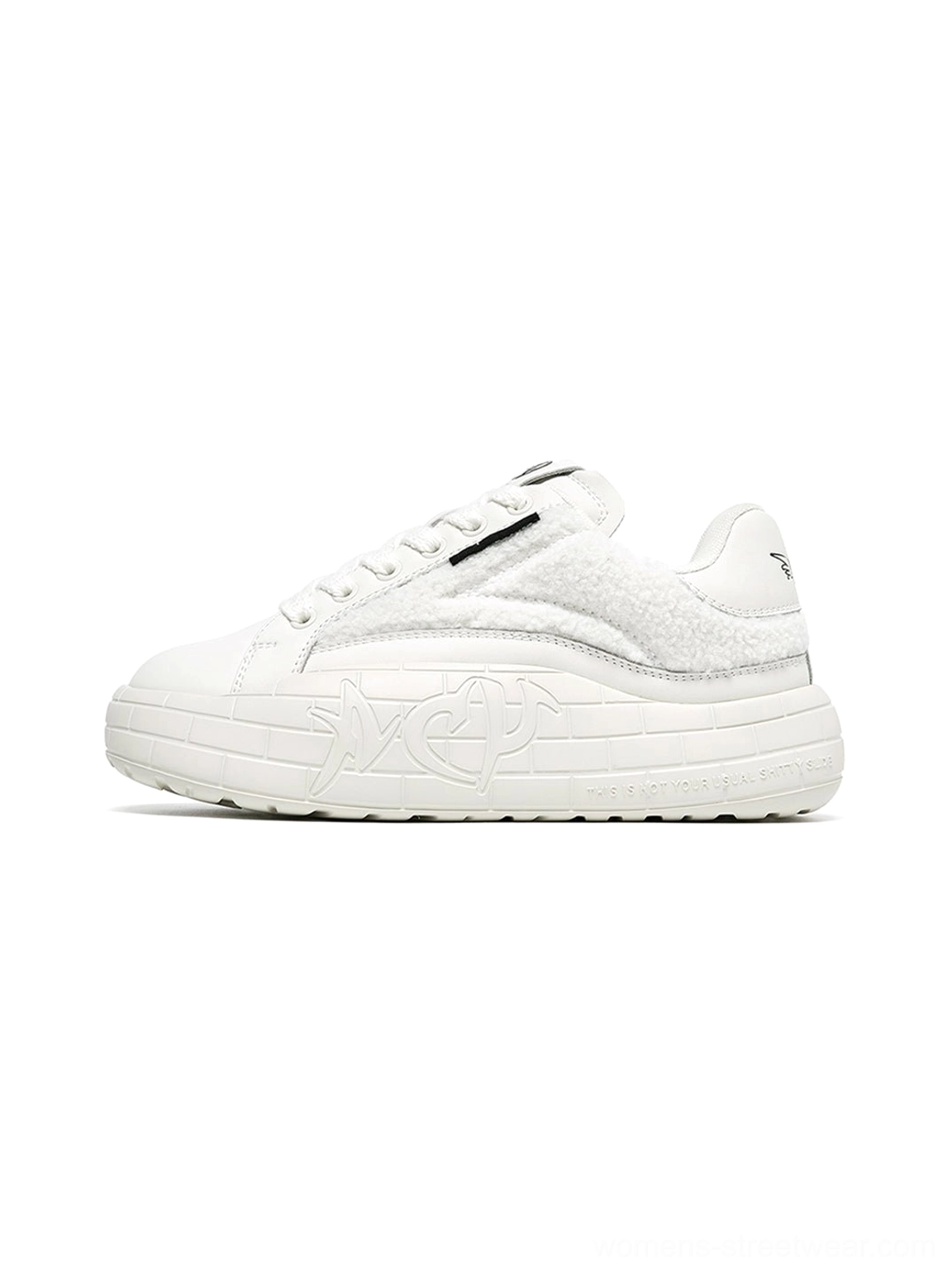 White fleece-panel platform sneakers with plush upper texture, lace-up fastening, and sculpted thick soles