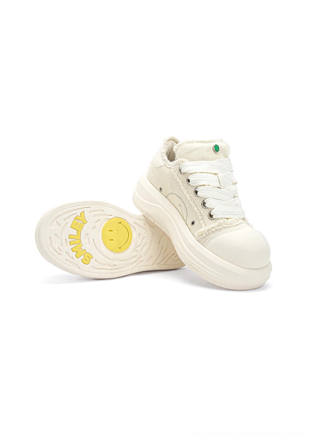 White frayed canvas platform skate sneakers showing yellow graphic insole print and thick textured rubber sole