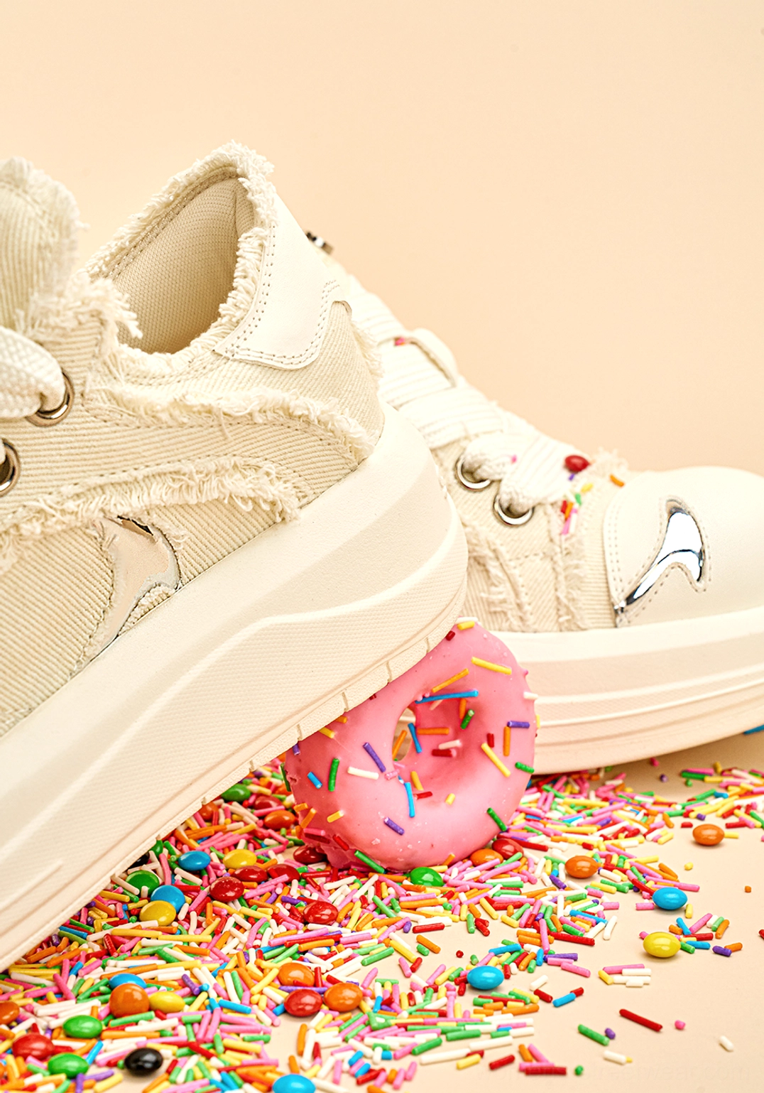 Rear three-quarter view of white canvas platform skate sneakers with frayed heel seams and chunky rubber outsole