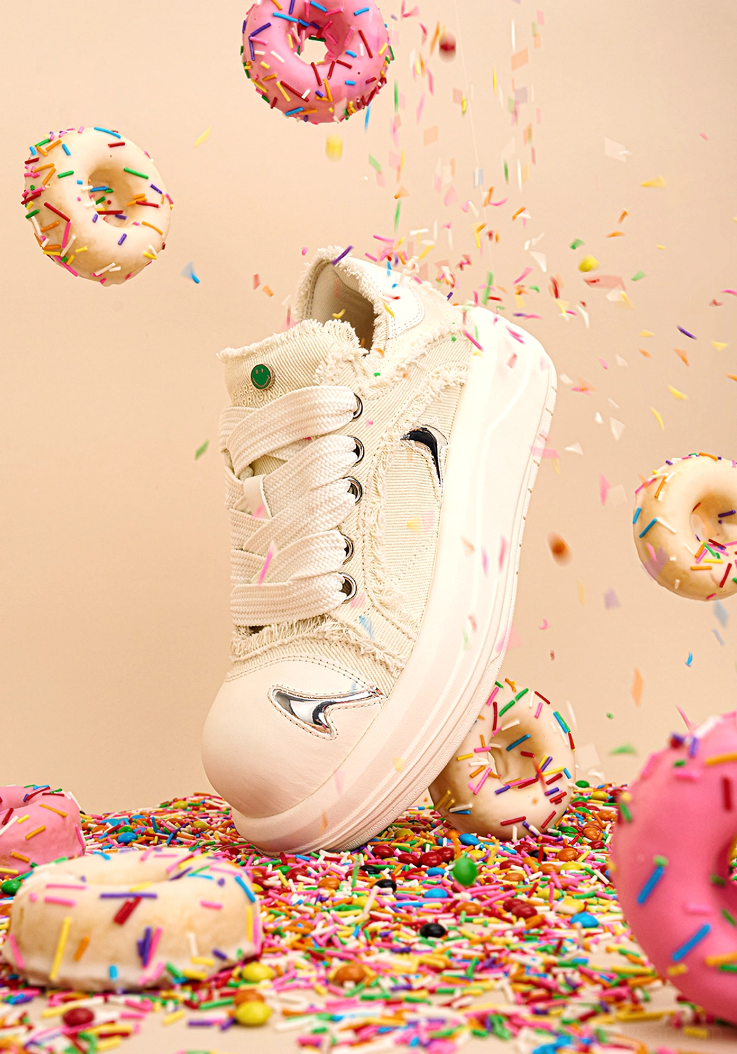White chunky platform skate sneakers with distressed frayed canvas upper and metallic toe detail three-quarter view