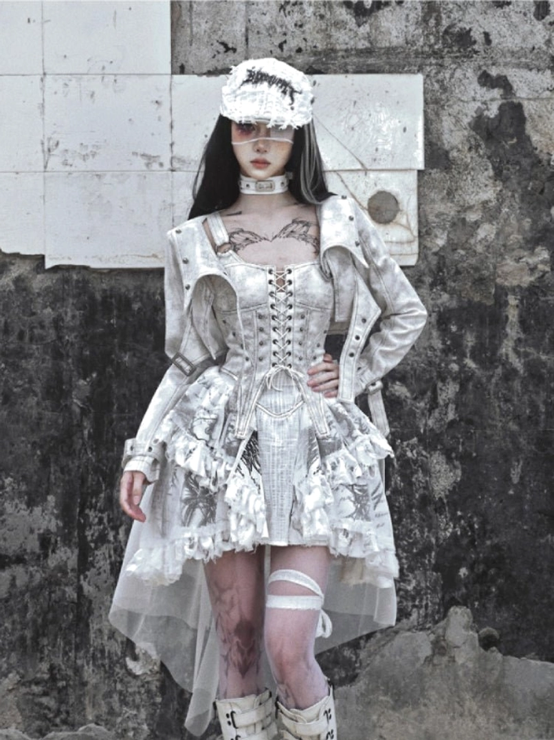 White gothic corset high-low dress with sheer tulle train styled as an alternative streetwear outfit with cropped jacket