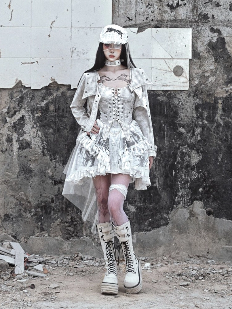 White gothic corset high-low tulle dress styled with a matching cropped jacket in alternative streetwear look