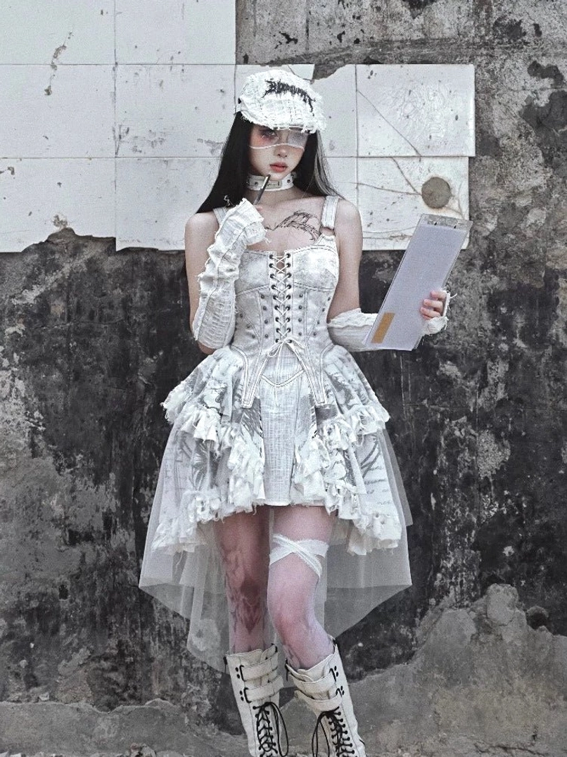 White gothic lace-up corset high-low tulle train dress shown in a front three-quarter full-body streetwear look