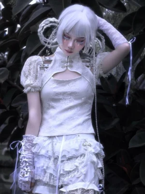 White Gothic Lolita two-piece outfit featuring high waist lace ruffle shorts styled with a cutout high collar top in a dark garden setting
