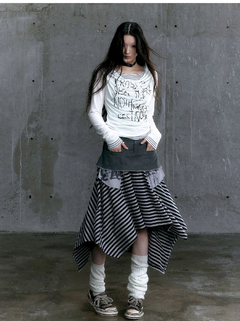 Back three-quarter view of white graffiti layered long sleeve top with striped underlayer styling