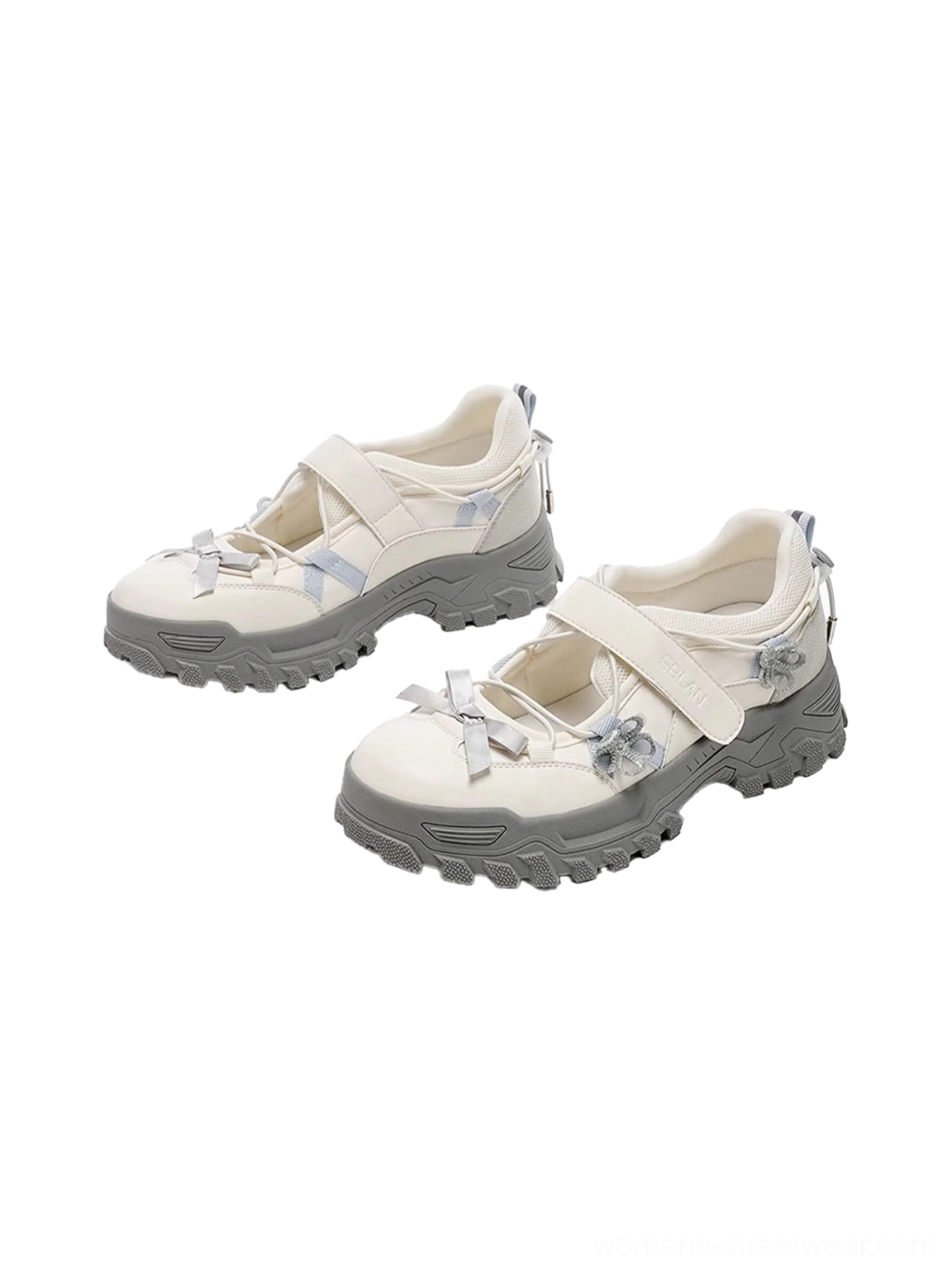 Pair of white and gray Mary Jane platform sneakers with bow ornaments Velcro straps and rugged streetwear soles