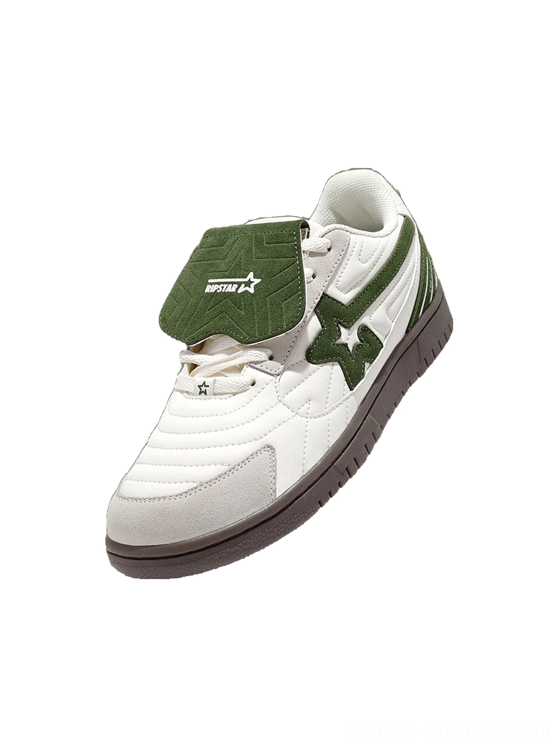 Close up of a white and green low top sneaker showing the star printed detachable tongue quilted toe and layered suede side panel