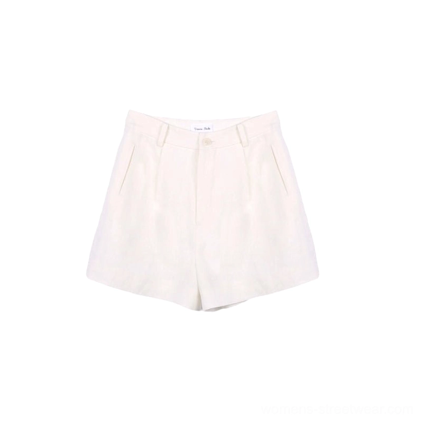 Flat lay product view of white high-waisted linen pleated shorts showing the button waistband, front pleats, straight-leg cut, and side pockets
