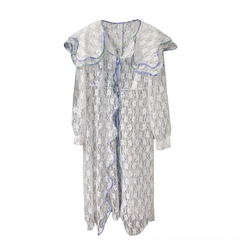 Flat lay front view of a white sheer lace sailor collar duster coat displaying the iridescent trim, ruffled collar, adjustable front tie, long sleeves, and asymmetric hem