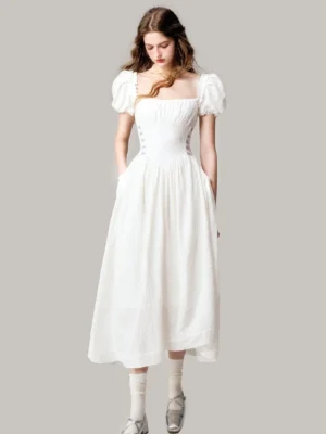 Off-white jacquard midi dress with square neckline, fitted waist, short puff sleeves, and softly textured romantic silhouette