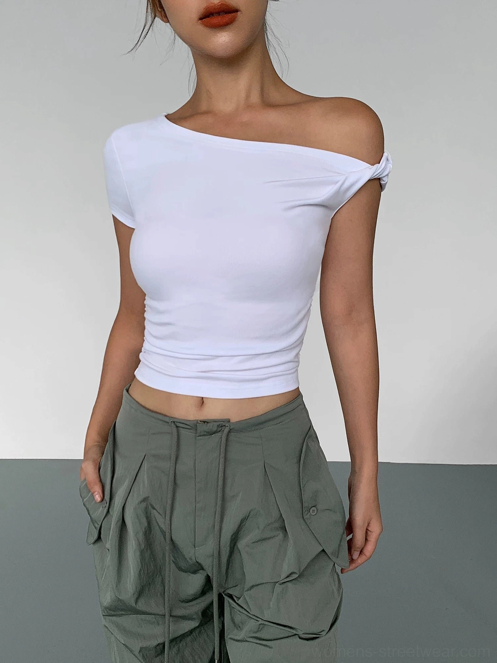 White Korean fashion asymmetric crop tee with one-shoulder neckline and fitted waistline