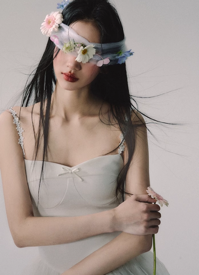 White lace strap gown with airy layered tulle skirt and refined sweetheart neckline inspired by modern bridal fashion