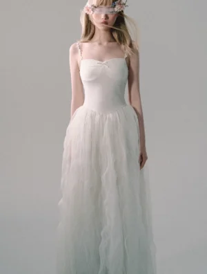 White lace strap tulle gown shown in a full-body front view with sweetheart neckline, satin bow, fitted bodice, and flowing floor-length skirt