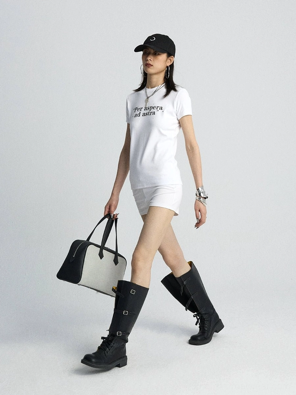White lace trim soft micro shorts styled with a slogan tee handbag and buckle knee high boots
