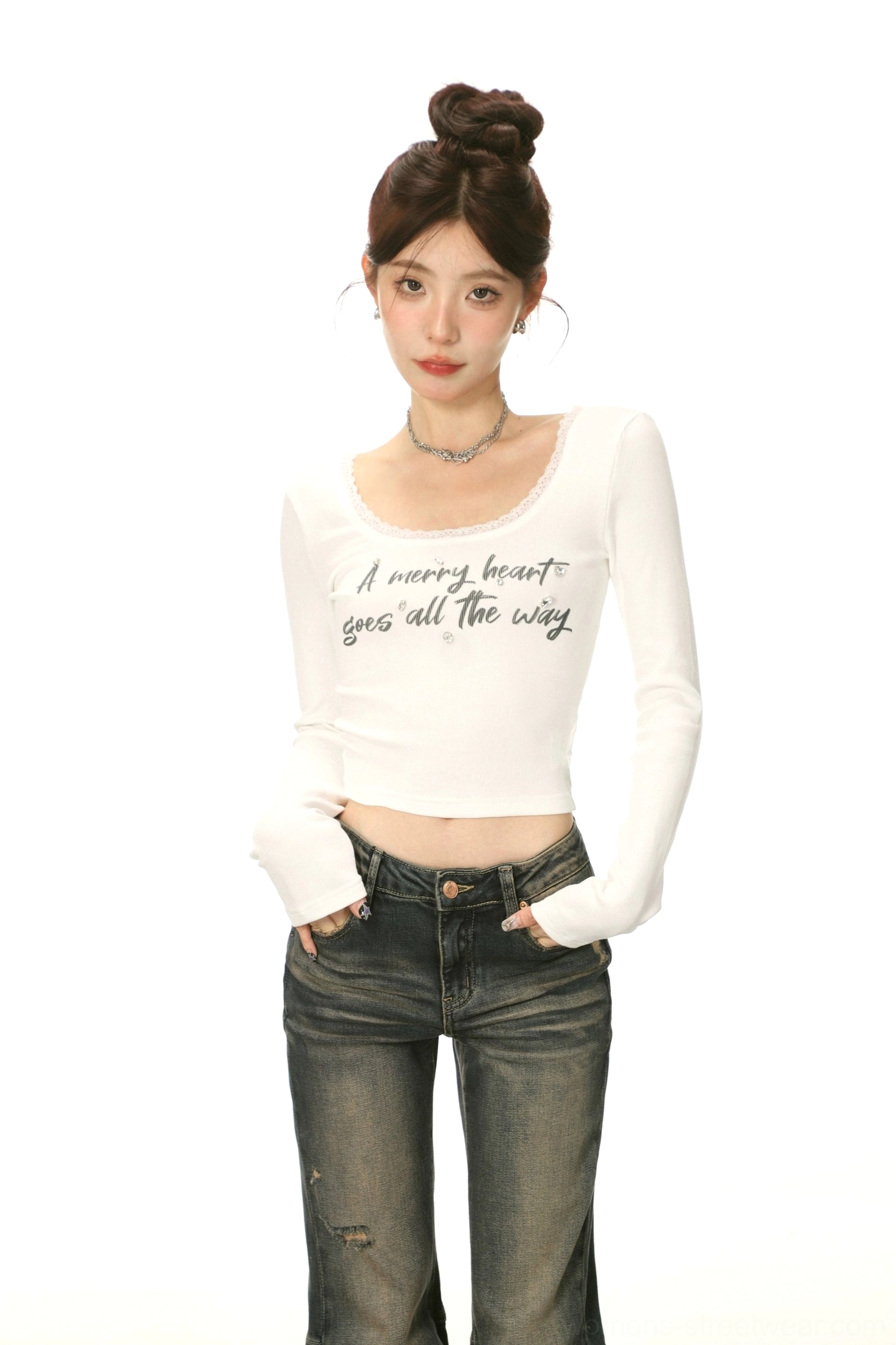 White lace-trimmed U-neck cropped long-sleeve streetwear shirt styled with jeans and a delicate necklace for a Y2K Korean fashion look
