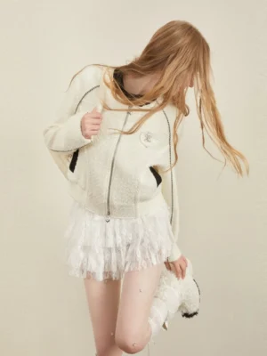 White layered tulle mini skirt styled with a zip-up knit coat in a feminine Korean street style outfit