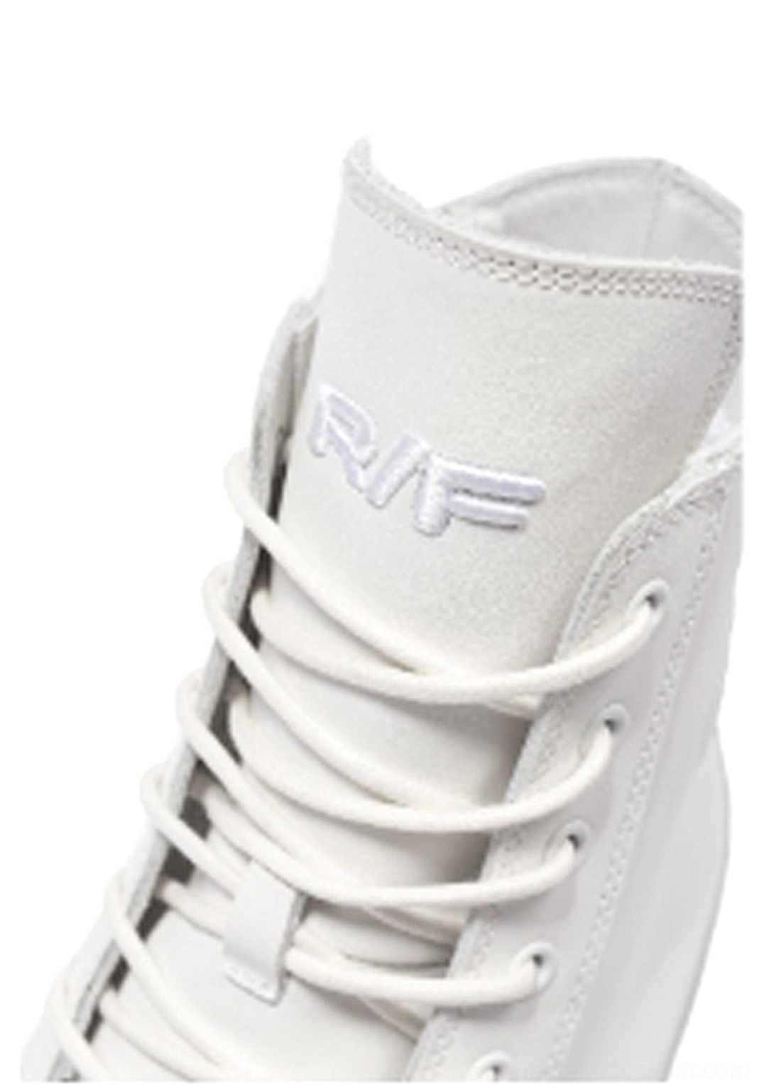 Close-up of white leather high-top boot ankle collar, dense eyelets, matching laces, and smooth leather construction