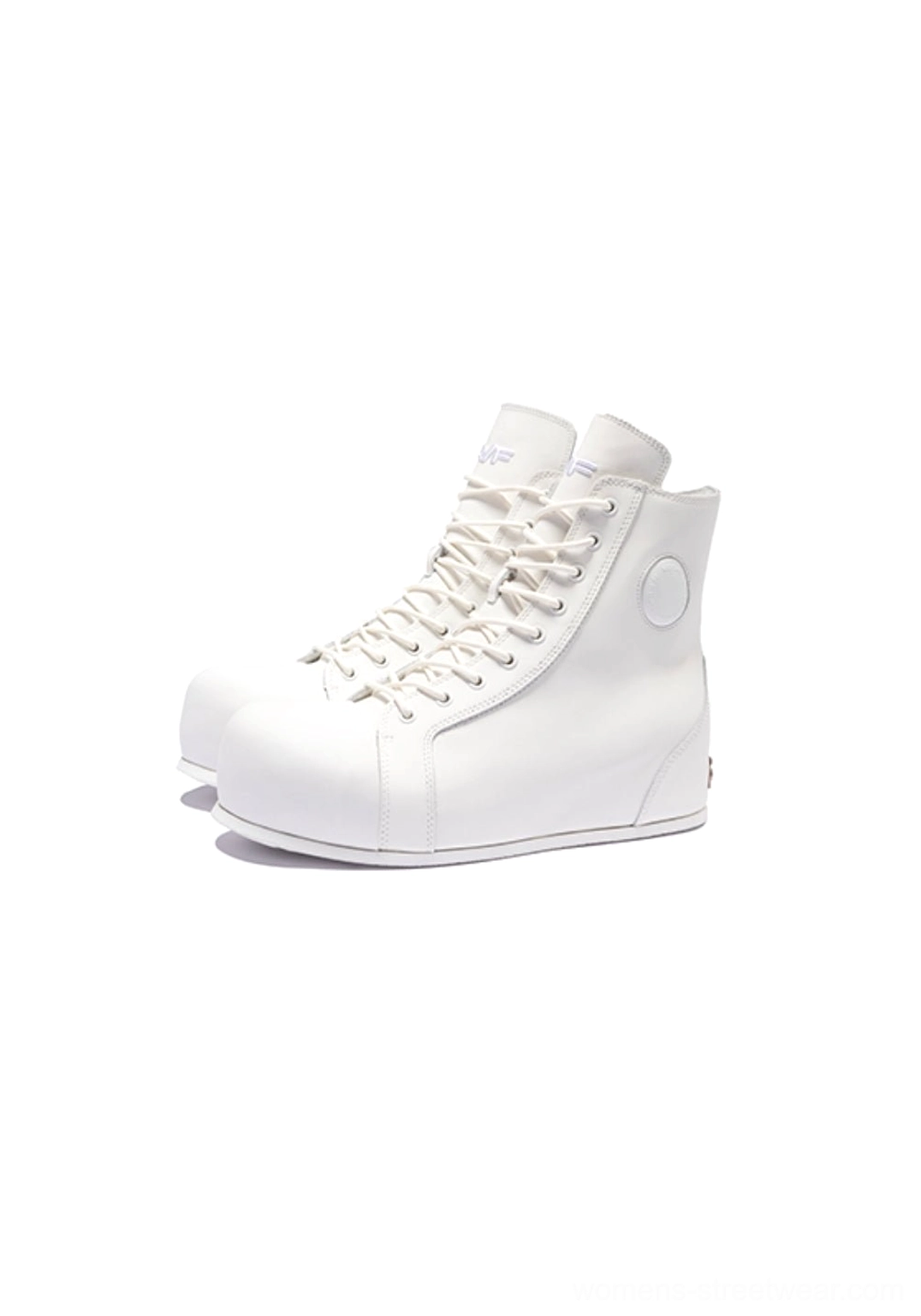 White leather high-top boots with rounded toe, lace-up shaft, sculpted elevated sole, and metallic heel detail in studio view