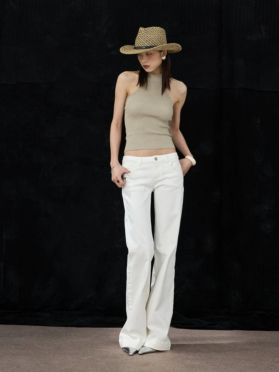 White low-rise flare jeans styled with a cropped top for a relaxed Korean streetwear inspired outfit