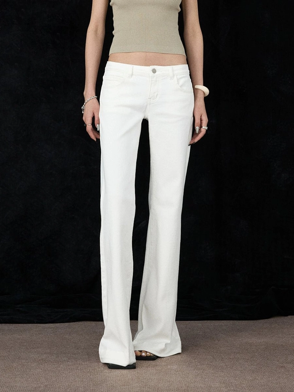 White low-rise flare jeans with full-length Y2K streetwear denim silhouette and classic five-pocket design