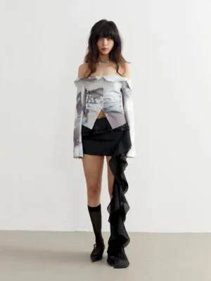 Full-body view of a white marble print off-shoulder fitted top styled with a black slit skirt in a modern streetwear outfit