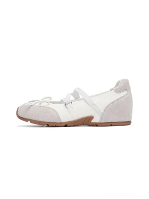 White Mary Jane ballet sneaker left side profile with light grey suede-textured panels crossed bow straps and brown gum rubber sole