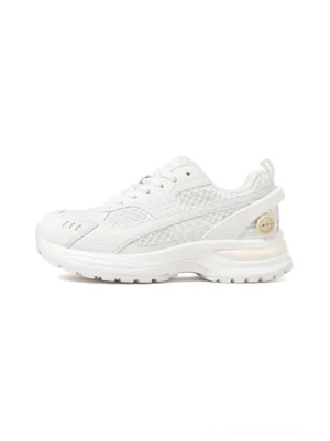 Side profile of white mesh runner sneakers with curved tonal overlays, chunky sculpted sole, and decorative heel emblem