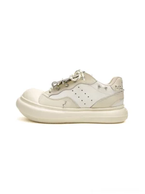 White metal stud round-toe platform streetwear sneakers in a clean side product view with perforated panels and chunky elevated sole