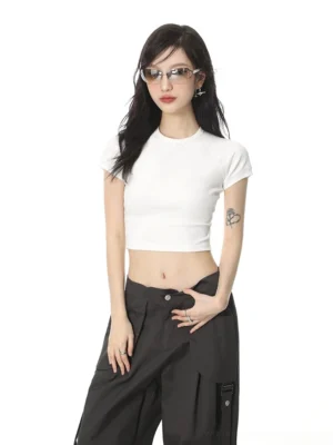 White minimalist crop top tee half body front view female model cargo pants streetwear aesthetic