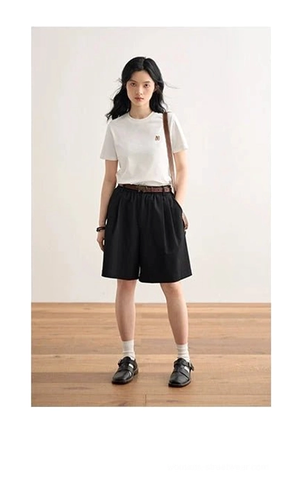 White minimalist embroidered logo crew neck t-shirt full body casual fit black shorts streetwear