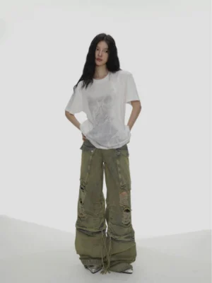 White oversized bow graphic streetwear T-shirt front full body view styled with green cargo pants