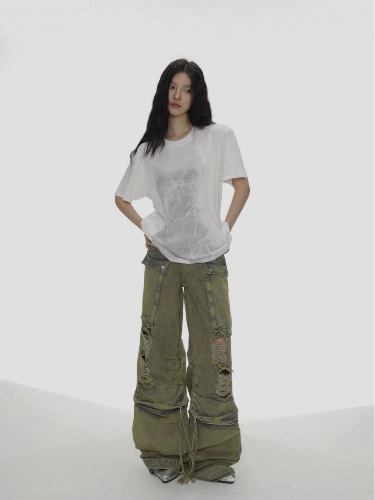 White oversized bow graphic streetwear T-shirt front full body view styled with green cargo pants