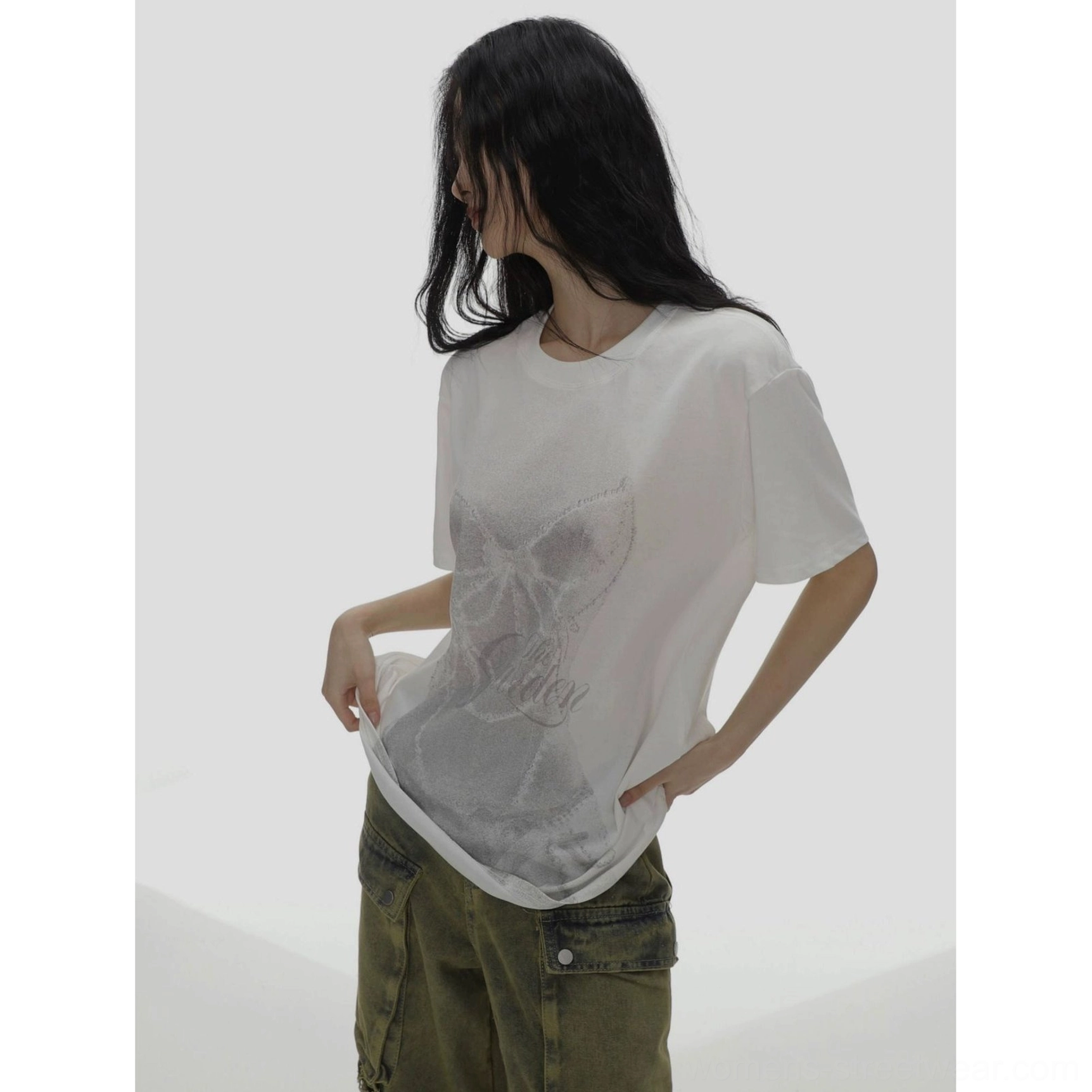 White oversized bow graphic T-shirt side detail showing relaxed drape and loose hem