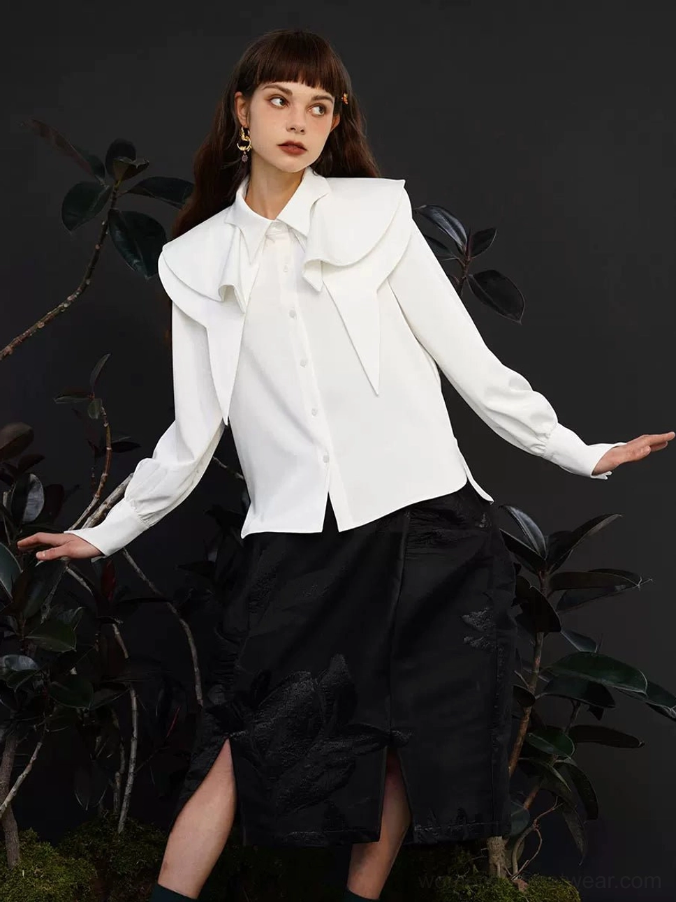 White cape collar blouse with oversized layered collar, full length puff sleeves, front button closure, and black slit midi skirt