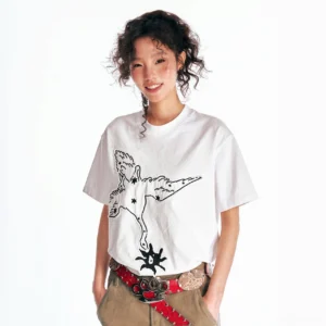 White oversized crane blossom graphic cotton T-shirt on female model with star details, spiky streetwear print, brown cargo pants, and red belt