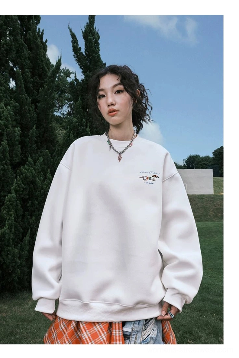 Front view of a white oversized crewneck sweatshirt with subtle left chest embroidery-style detail and relaxed Korean streetwear fit