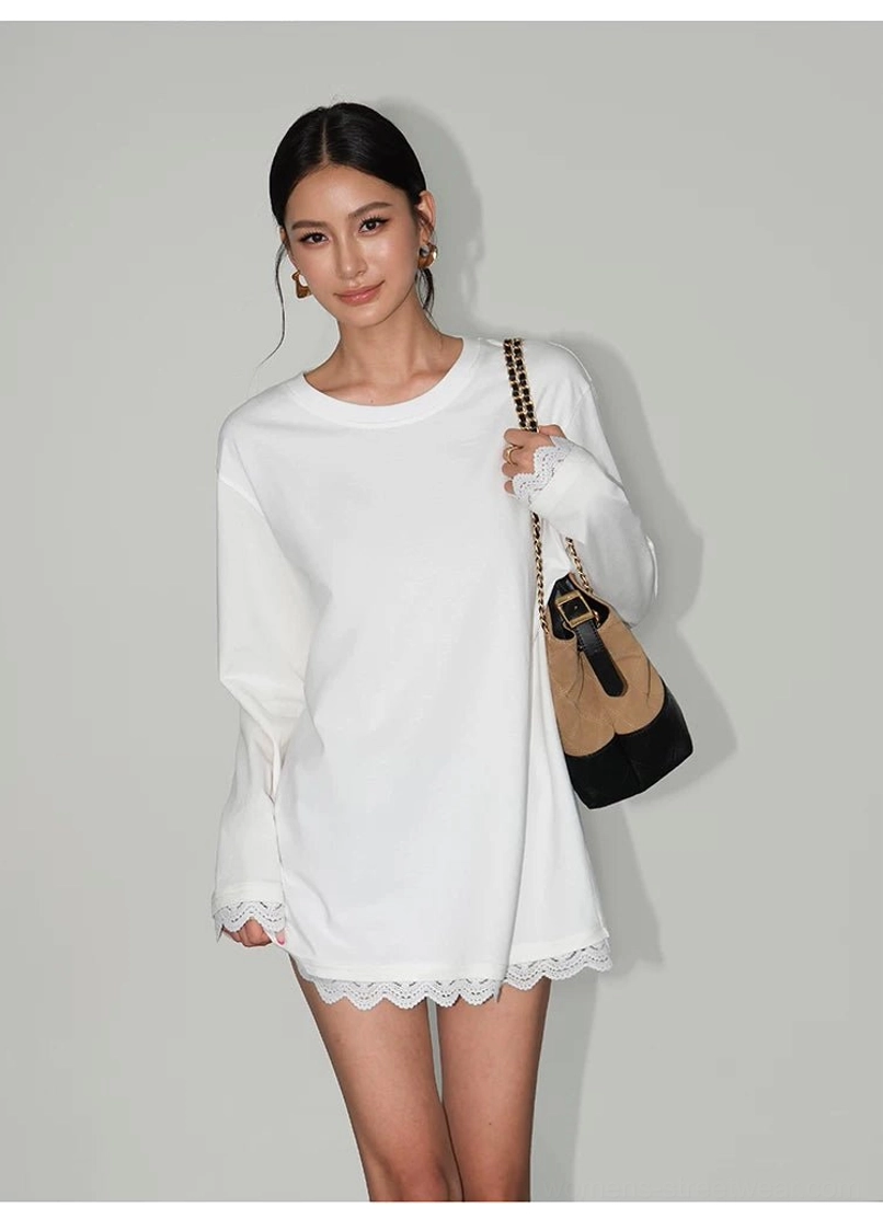 White oversized lace-hem long-sleeve tee dress in a relaxed three-quarter front view with a two-tone shoulder bag