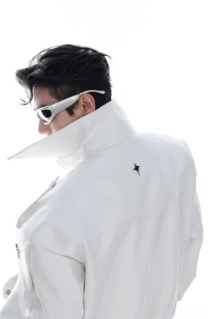White oversized PU leather moto jacket back three quarter view showing metallic star logo and structured collar