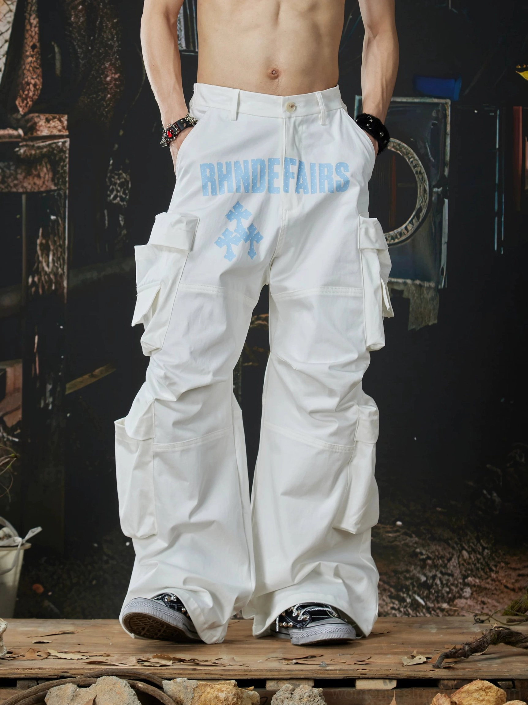 White oversized streetwear cargo pants back three-quarter view with layered cargo pockets and loose full-length leg