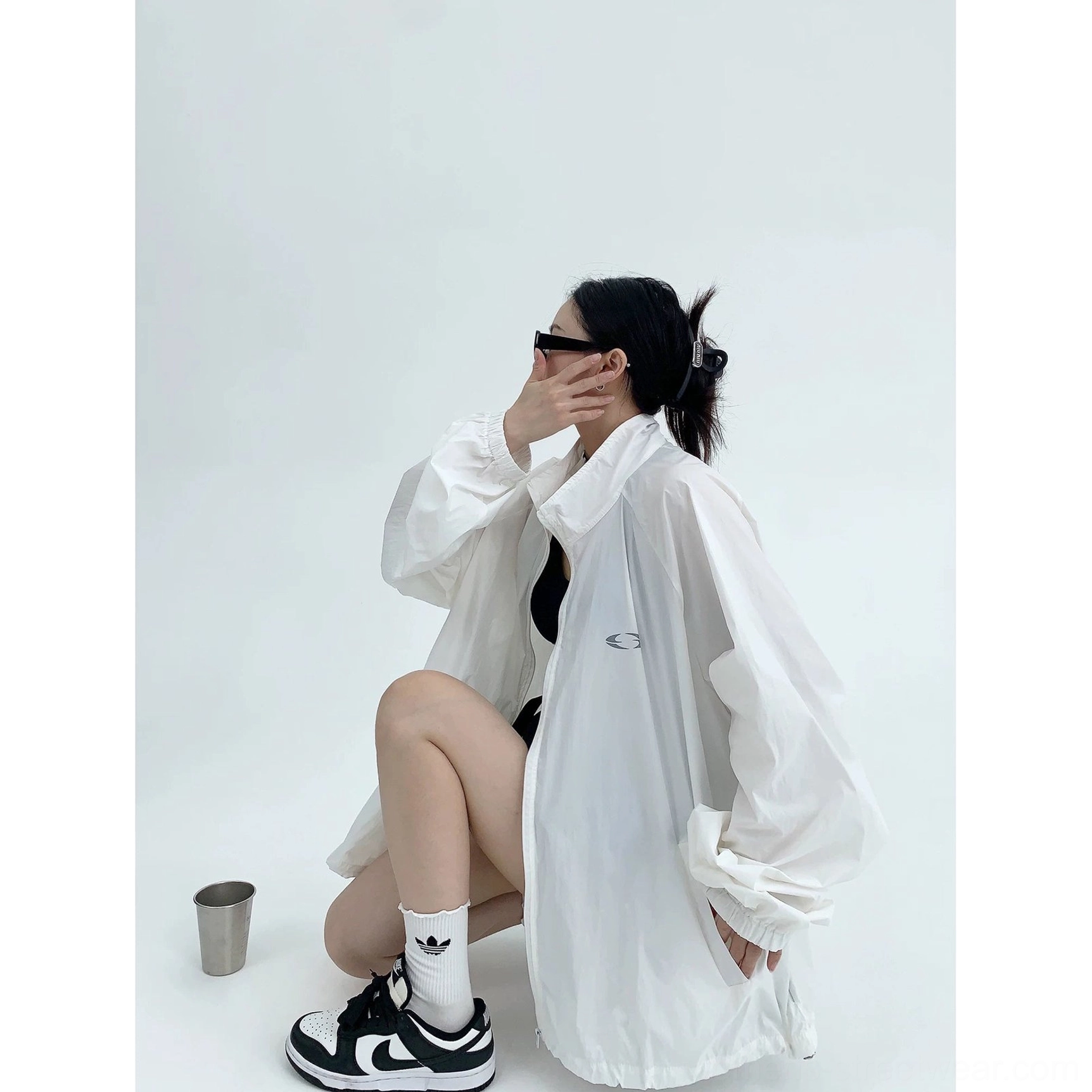 White oversized windbreaker jacket product image with lightweight woven polyester, stand collar, full zipper, elastic cuffs, and clean Korean streetwear look