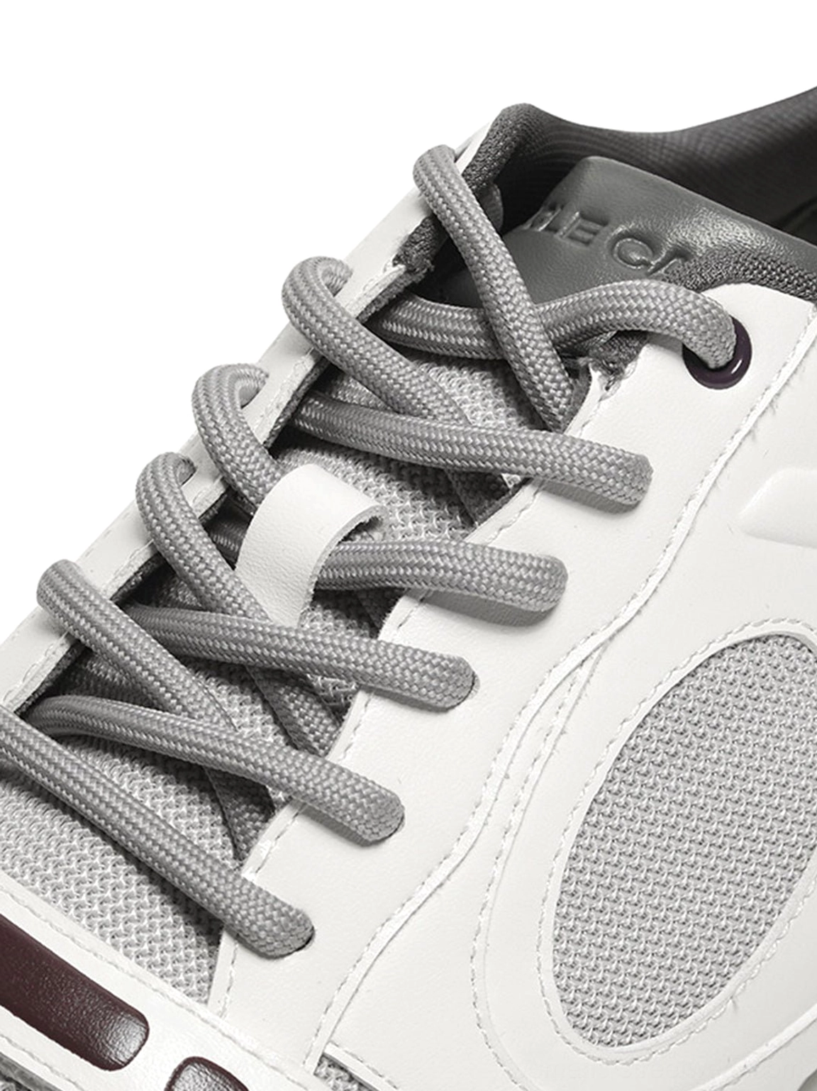 White perforated retro sport sneakers with burgundy contrast trim unisex low top sneaker product detail view