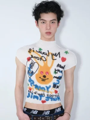 Close-up of white slim-fit cropped mock neck T-shirt showing reversed graffiti lettering cartoon rabbit heart and star graphic