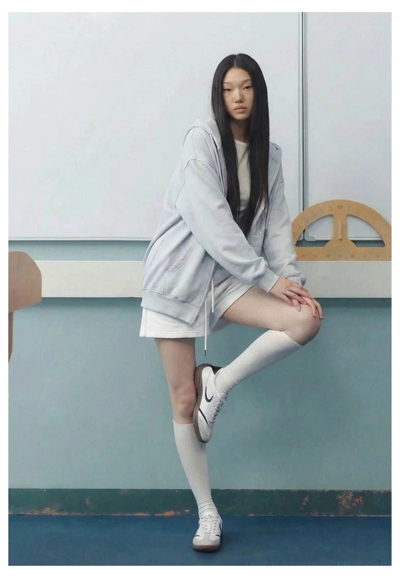 White retro court sneakers worn with knee high socks and casual loungewear in an everyday classroom inspired streetwear outfit