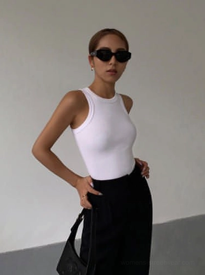 White ribbed knit tank top professional product photography studio view showcasing classic white colorway