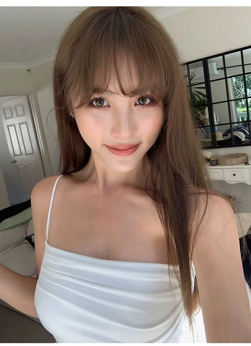 White ruched cami crop top with square gathered neckline and delicate spaghetti straps in an indoor outfit photo