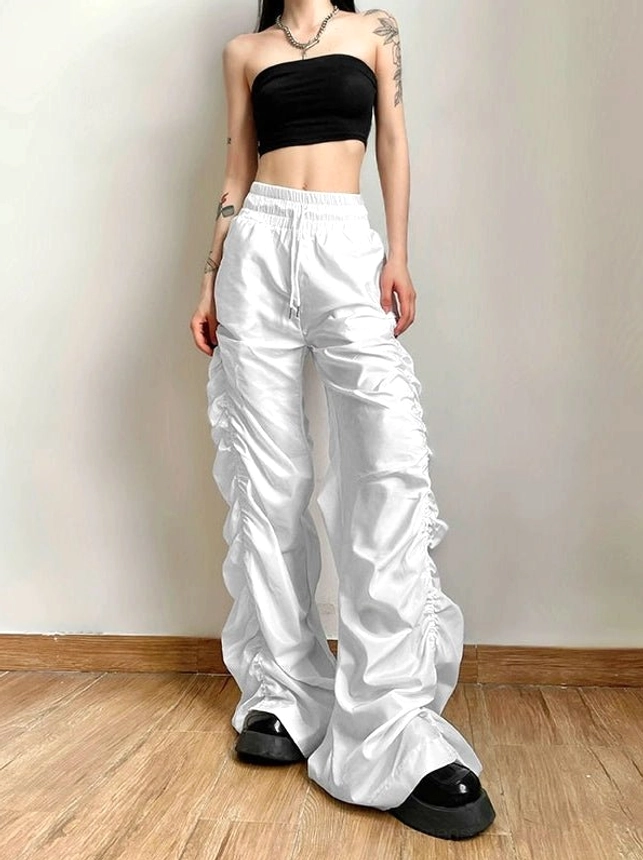 White ruched high-waist wide-leg streetwear cargo pants with glossy finish styled with a black strapless crop top