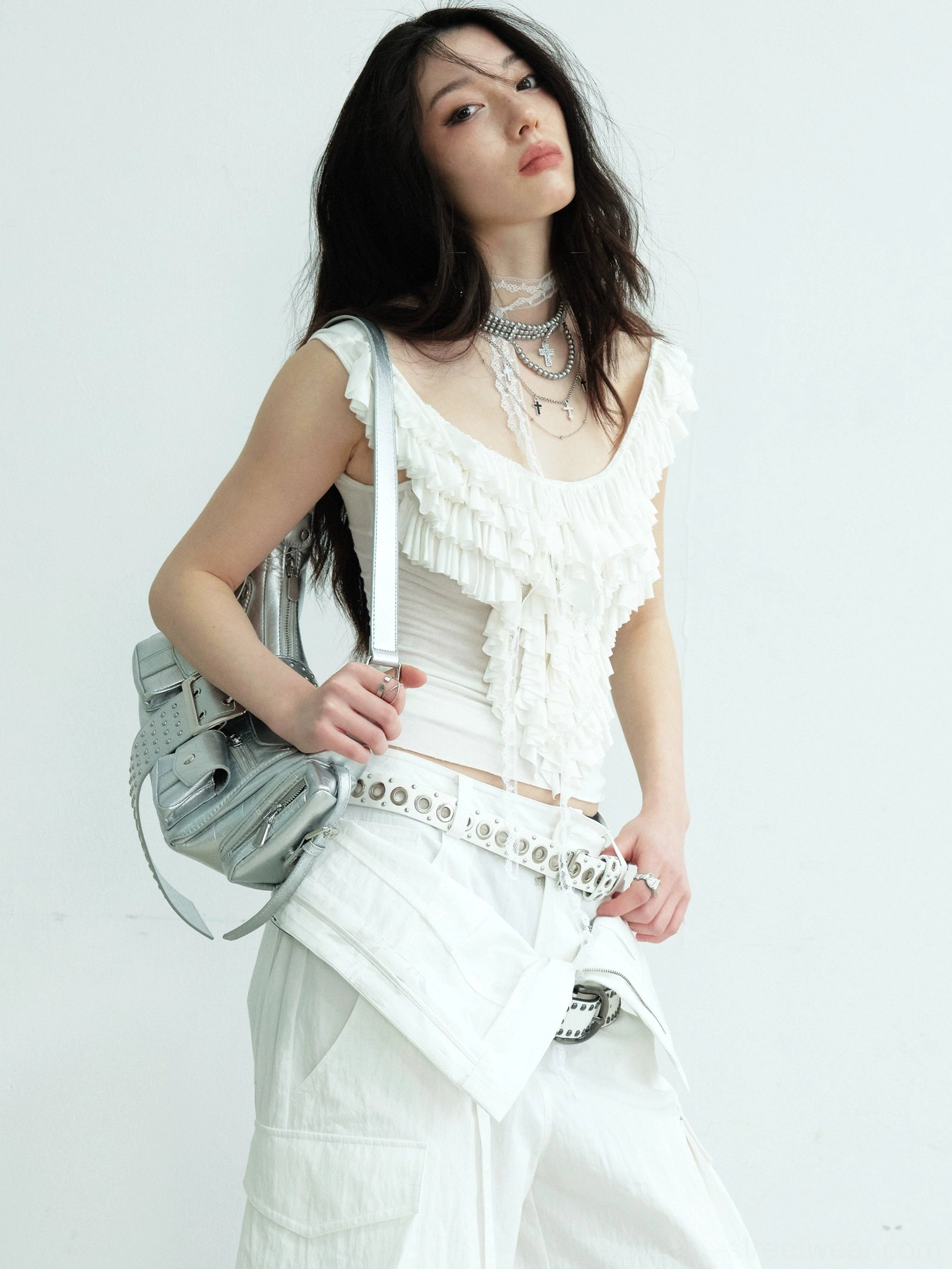 White ruffled lace neckline fitted tank top with silver shoulder bag and layered jewelry in an Acubi Y2K outfit