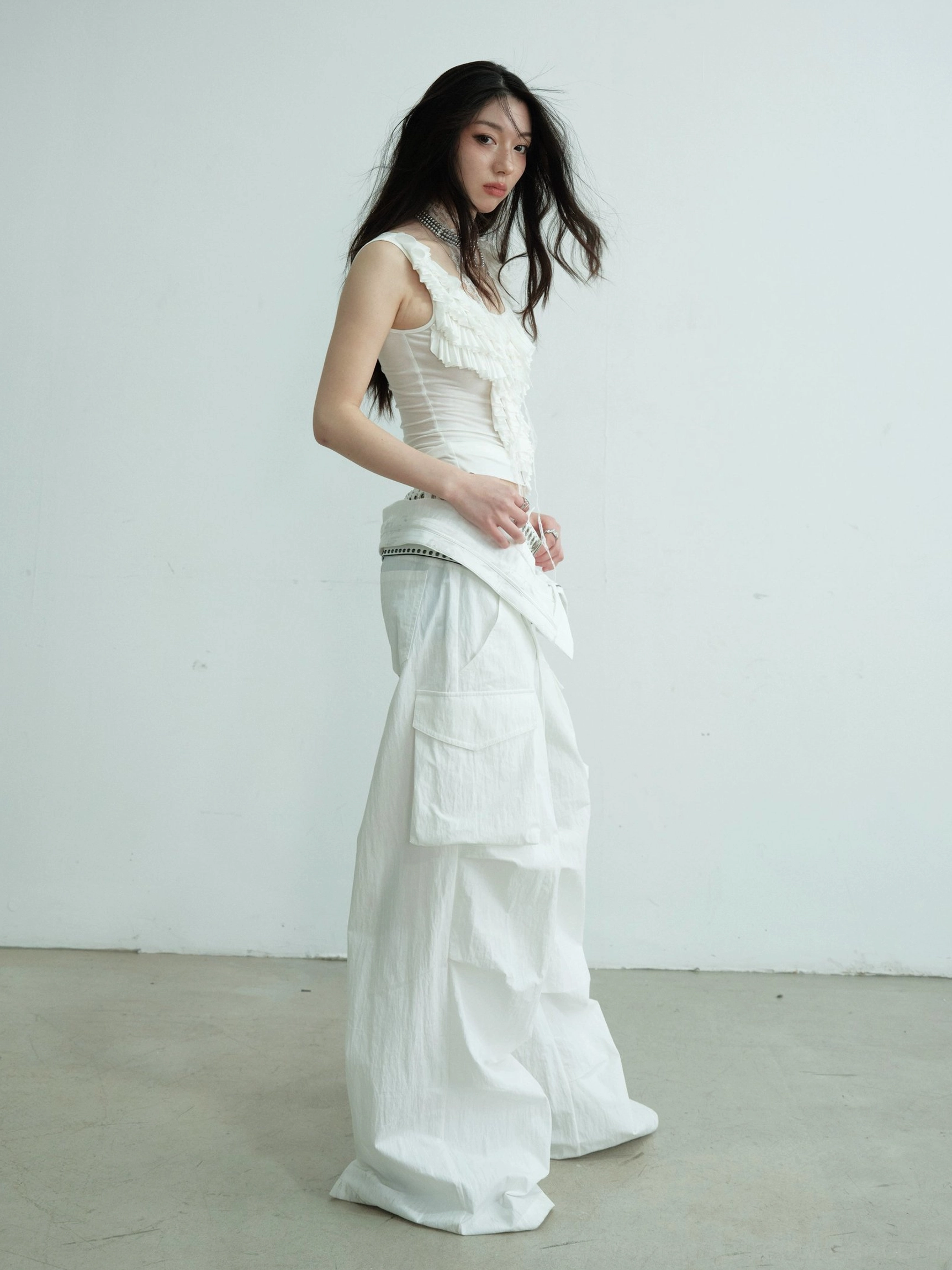 White ruffled lace scoop neck Y2K tank top side profile showing the slim waist-fitting silhouette