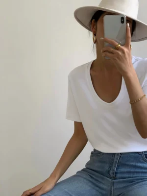 White scoop neck short-sleeve T-shirt on a woman in a relaxed Korean streetwear outfit with casual everyday styling