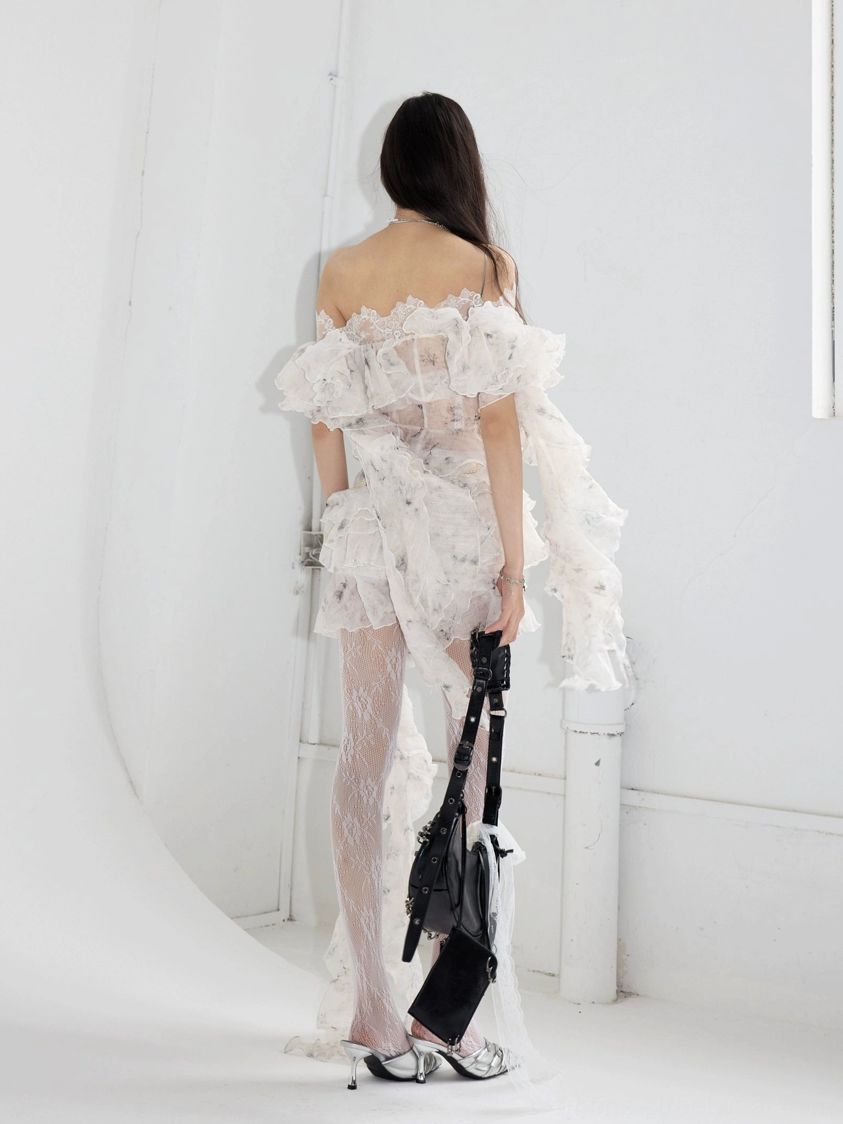 White sheer lace ruffle two-piece outfit with romantic grunge styling, tiered details and an asymmetrical trailing hem